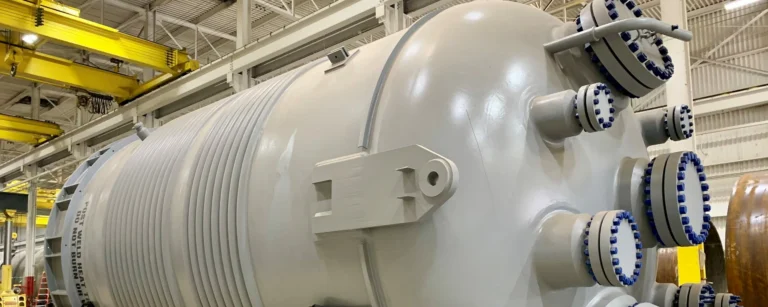 A large half-pipe jacketed reactor in a factory